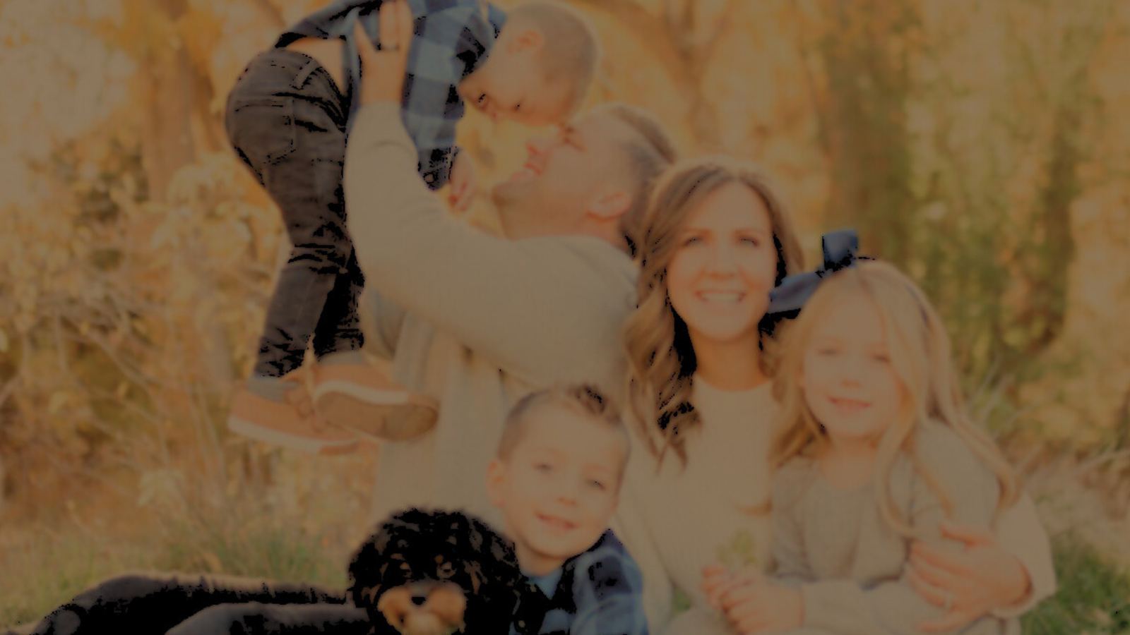 Jeremy Davis with his wife and kids outdoors